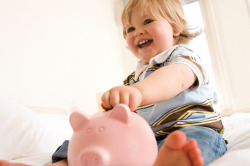 Child with piggybank - current HVAC rebates and specials - Major